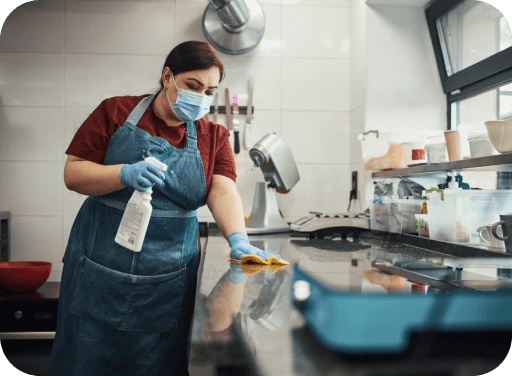 Staff cleaning kitchen
